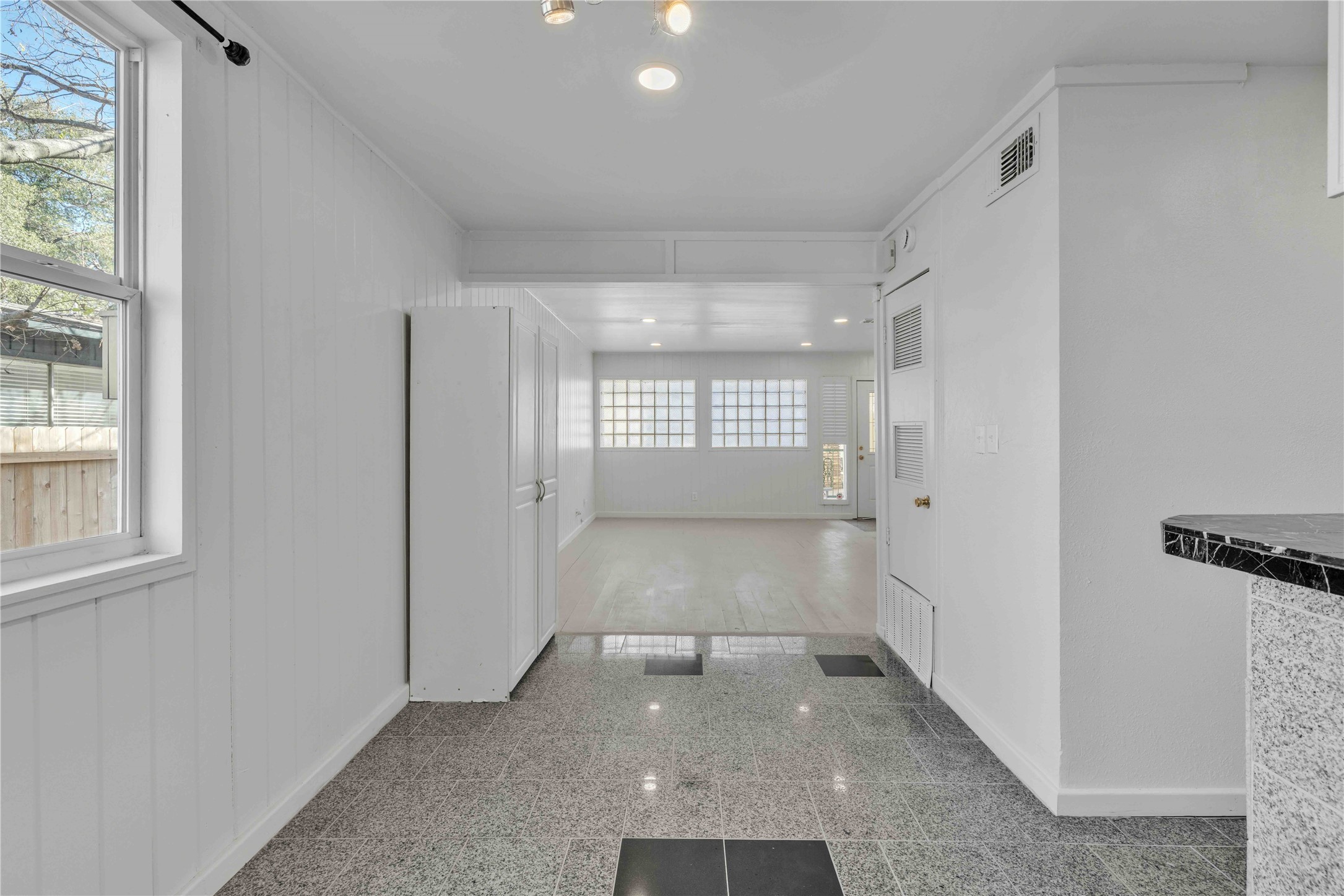 5210 Woodrow Avenue, Unit B Austin, TX 78756 - Photo 7 of 23 a view of a hallway with windows