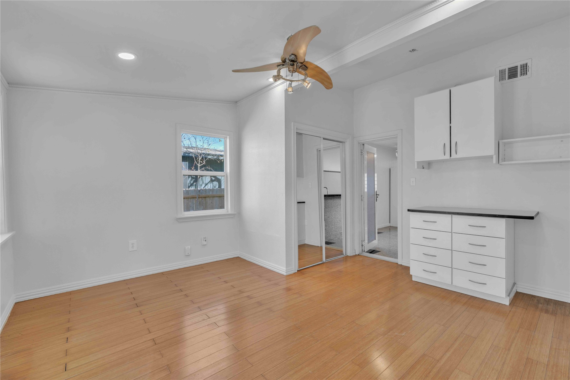 5210 Woodrow Avenue, Unit B Austin, TX 78756 - Photo 8 of 23 a view of a kitchen with cabinet and a chandelier