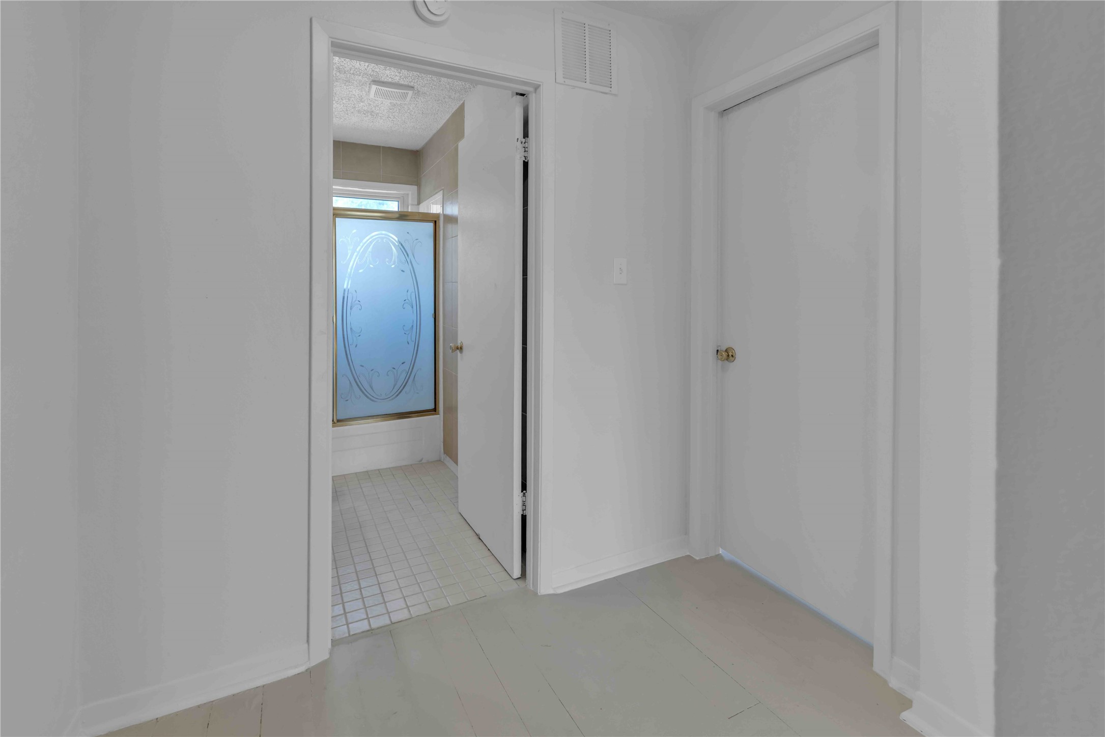 5210 Woodrow Avenue, Unit B Austin, TX 78756 - Photo 10 of 23 a view of an empty room with closet and wooden floor