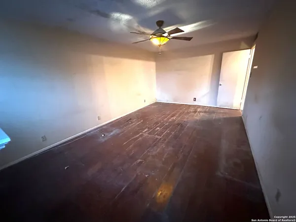 a view of an empty room and window