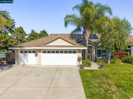 an aerial view of multiple houses with yard