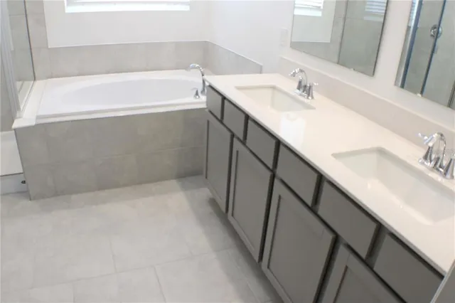 a bathroom with a sink and a bathtub