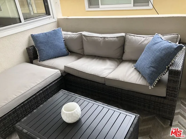 a balcony with furniture