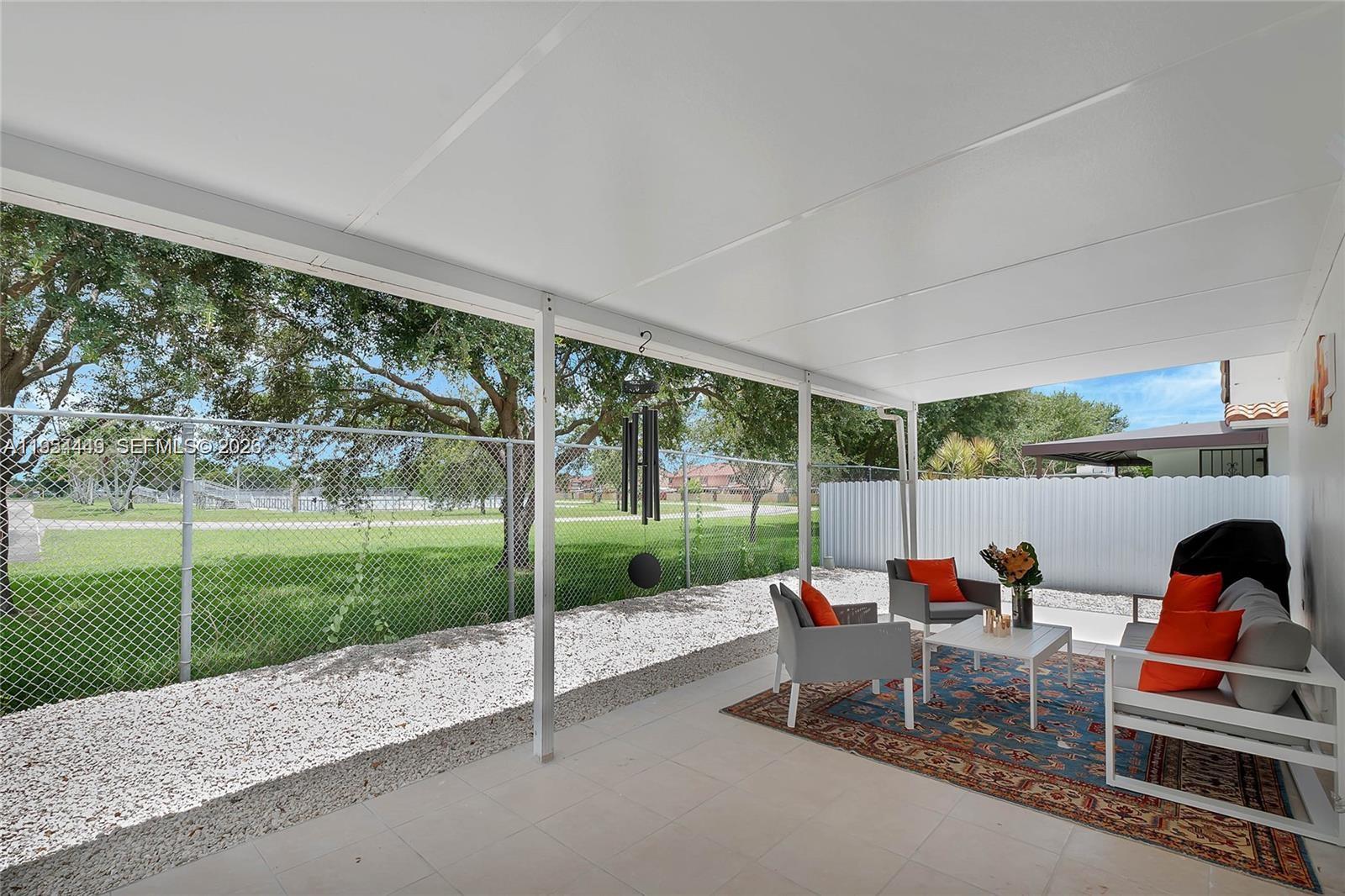 895 West 39th Place, Unit 1 Hialeah, FL 33012 - Photo 31 of 35 a outdoor view with a sitting space