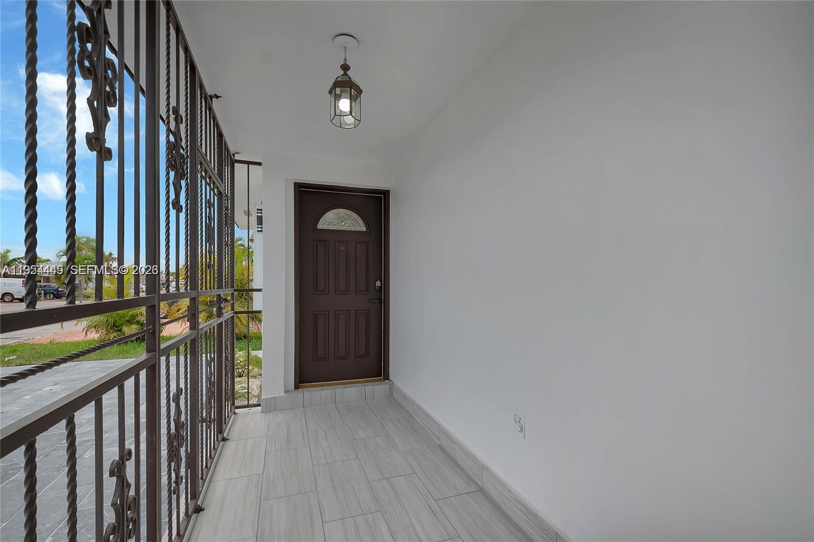 895 West 39th Place, Unit 1 Hialeah, FL 33012 - Photo 35 of 35 a view of hallway with stairs