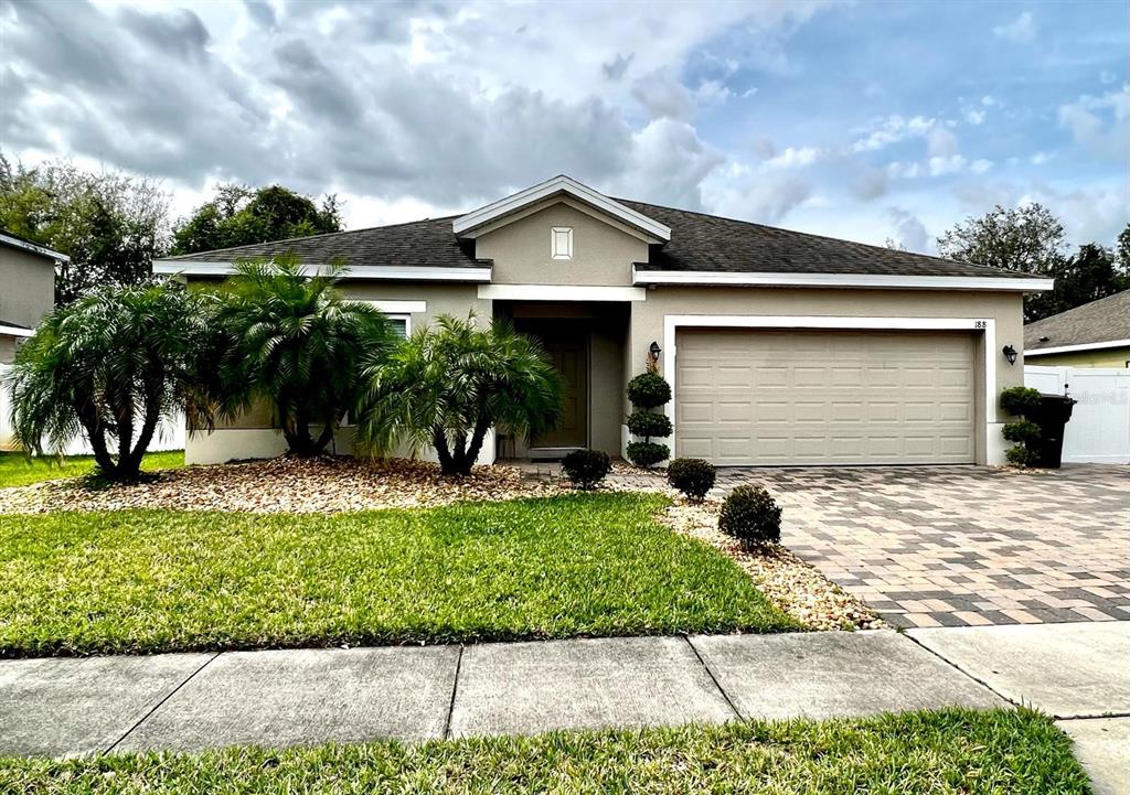188 Whispering Pines Way Davenport, FL 33837 - Photo 1 of 1 a front view of house with yard