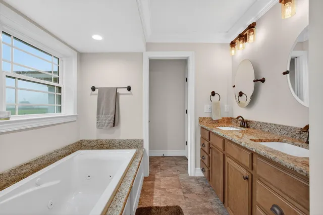 a bedroom with bed and a flat tv screen