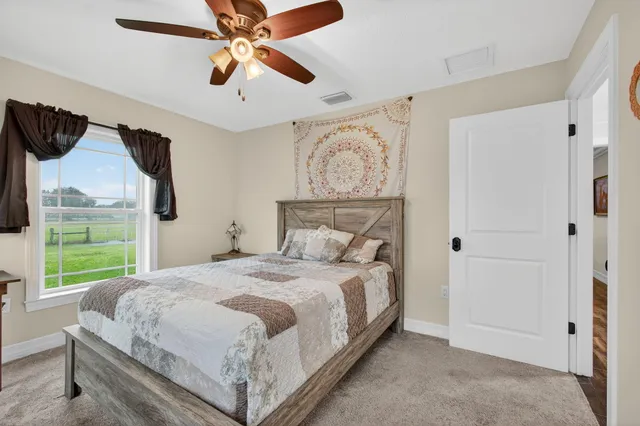 a view of a porch with backyard and garden