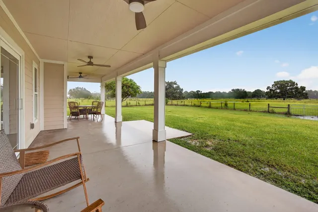 a view of a house with a yard and garage