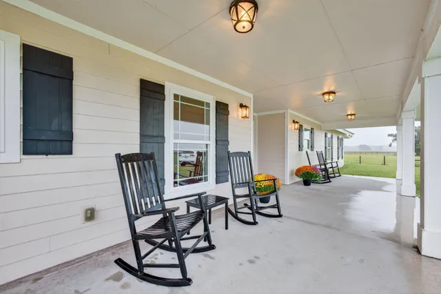 a view of a hallway view with wooden floor and staircase