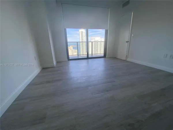 a bathroom with a double vanity sink toilet and mirror