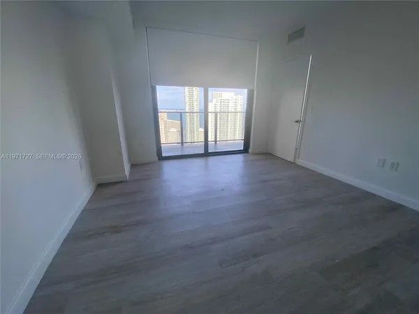 a bathroom with a shower and a toilet