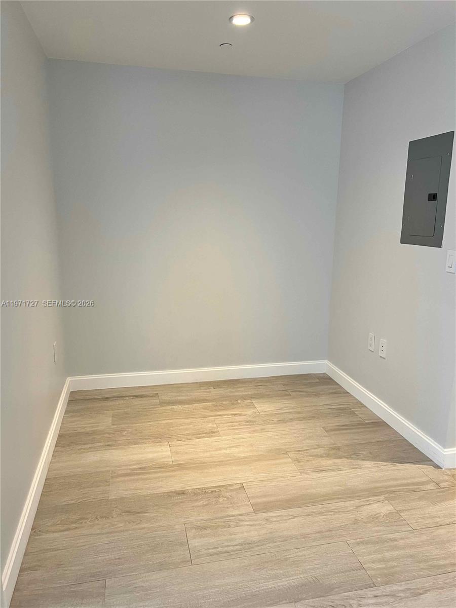 45 Southwest 9th Street, Unit 3703 Miami, FL 33130 - Photo 37 of 73 a view of a room with an empty space and wooden floor