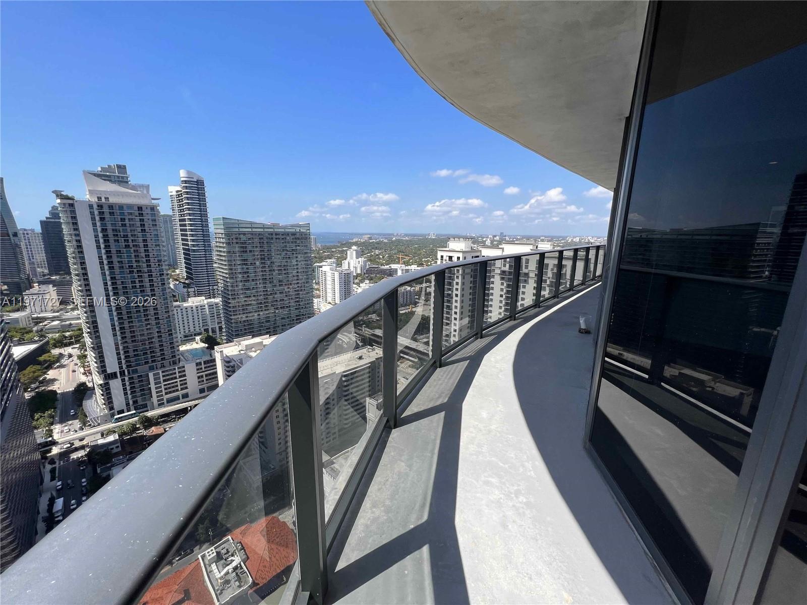 45 Southwest 9th Street, Unit 3703 Miami, FL 33130 - Photo 51 of 73 a view of balcony with wooden floor and city view