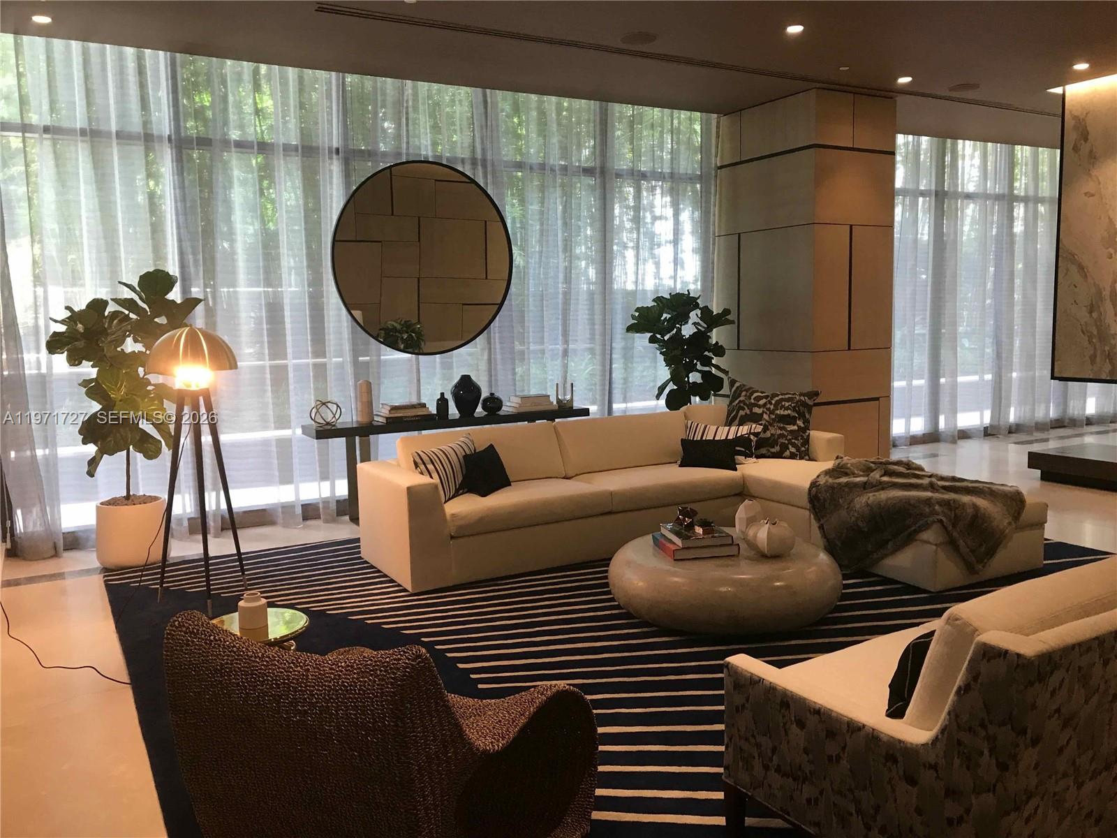 45 Southwest 9th Street, Unit 3703 Miami, FL 33130 - Photo 54 of 73 a living room with furniture and a large window