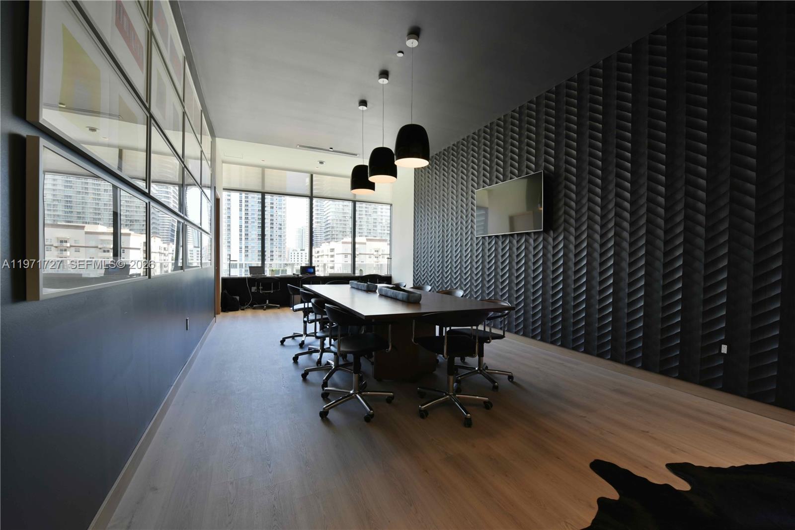 45 Southwest 9th Street, Unit 3703 Miami, FL 33130 - Photo 59 of 73 a view of a workspace with furniture and a window