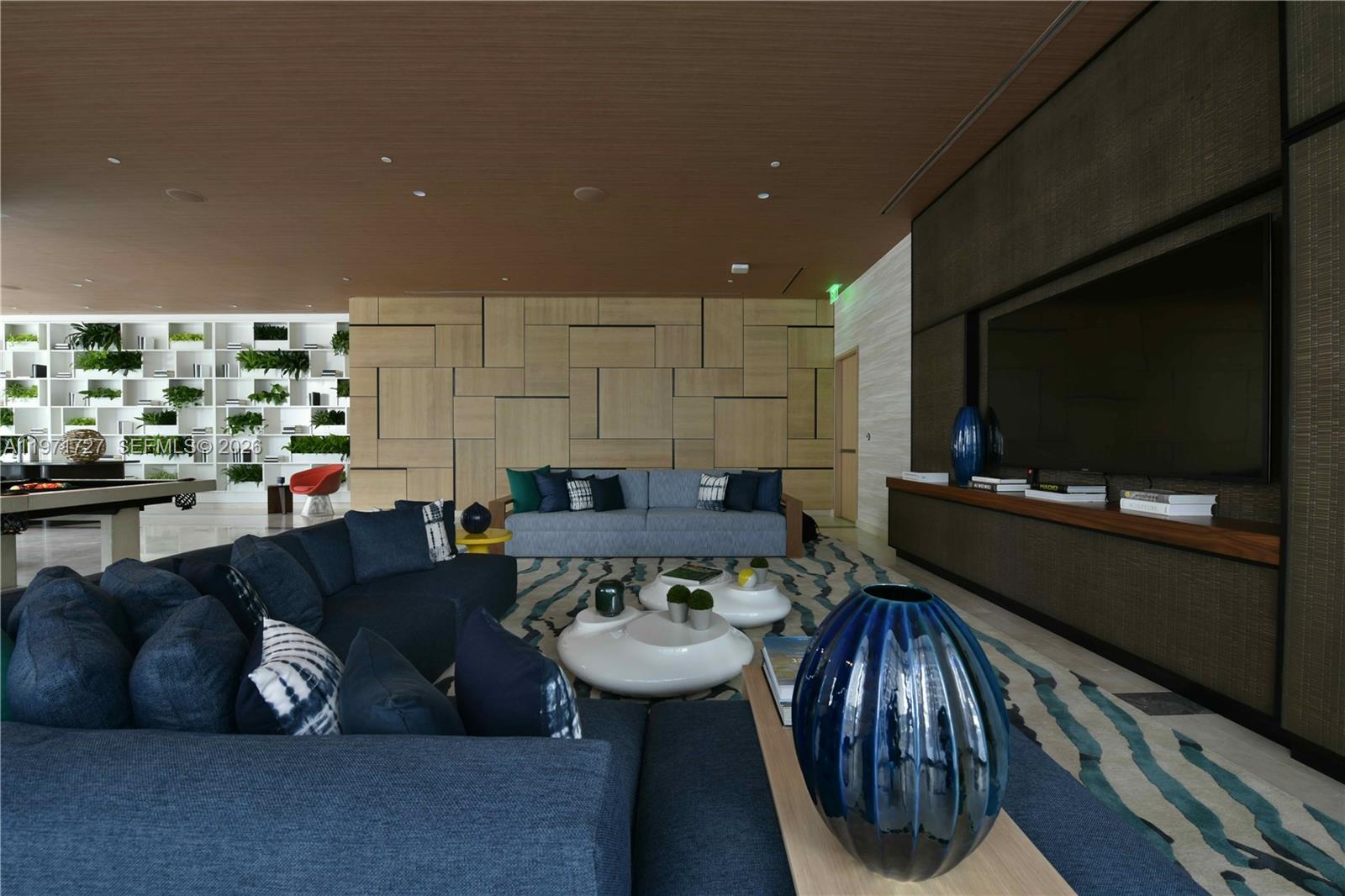 45 Southwest 9th Street, Unit 3703 Miami, FL 33130 - Photo 61 of 73 a living room with furniture and a flat screen tv