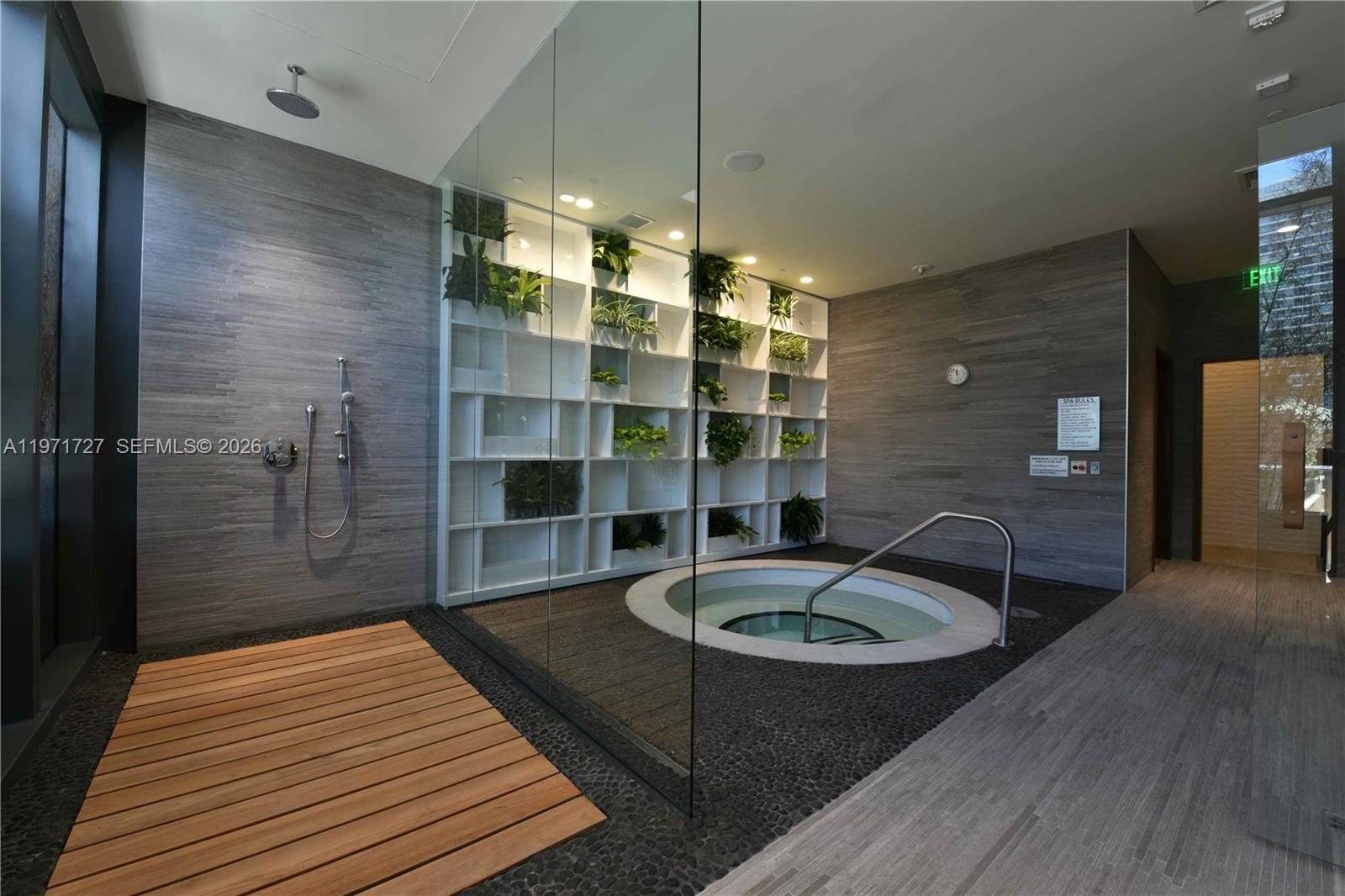 45 Southwest 9th Street, Unit 3703 Miami, FL 33130 - Photo 62 of 73 a bathroom with a sink a toilet a mirror and shower