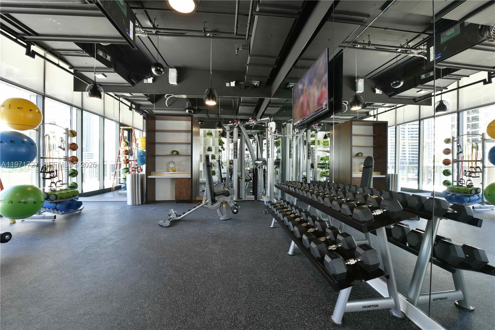 45 Southwest 9th Street, Unit 3703 Miami, FL 33130 - Photo 66 of 73 a view of a room with gym equipment