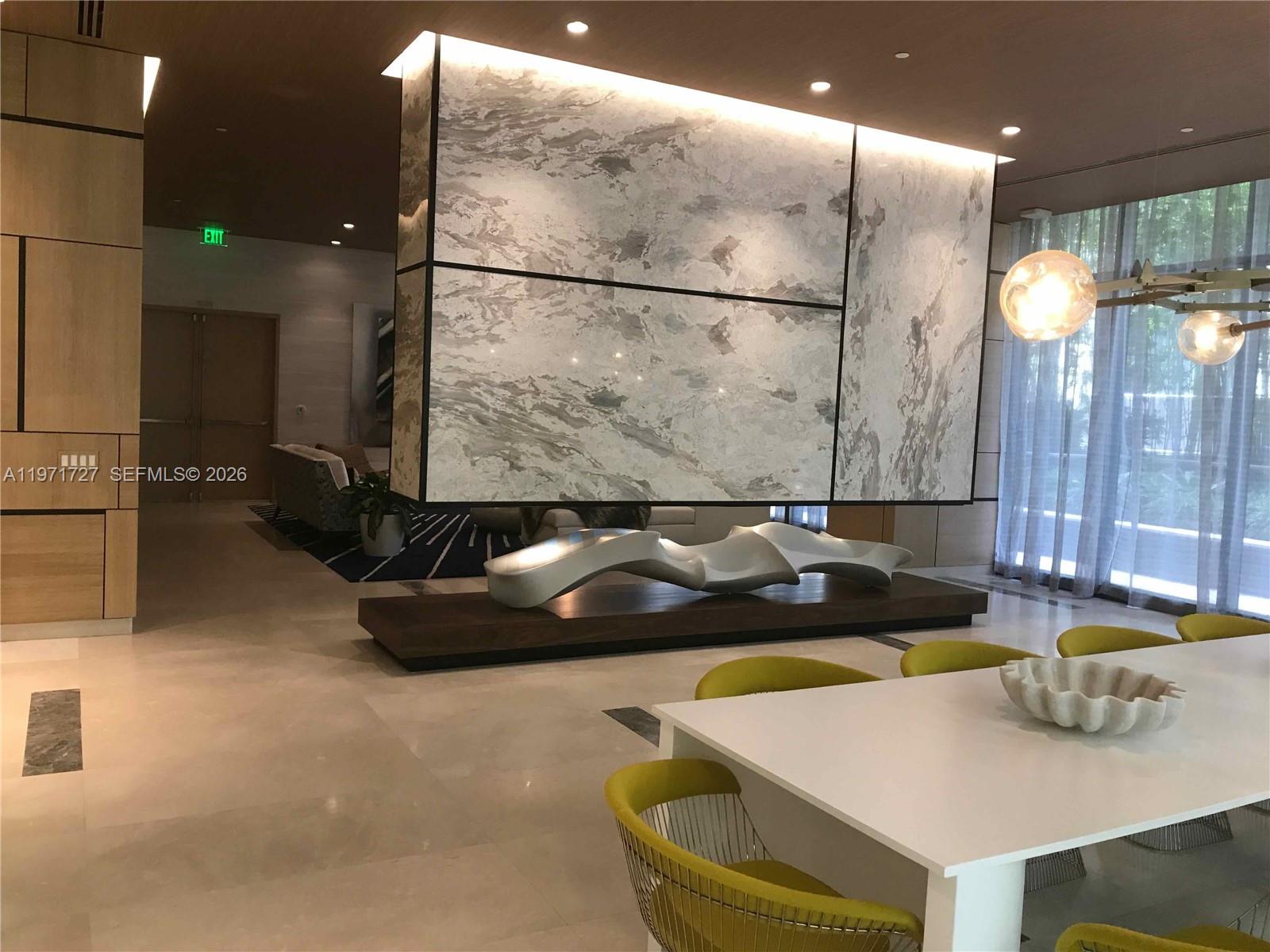 45 Southwest 9th Street, Unit 3703 Miami, FL 33130 - Photo 70 of 73 a kitchen with a sink and a refrigerator