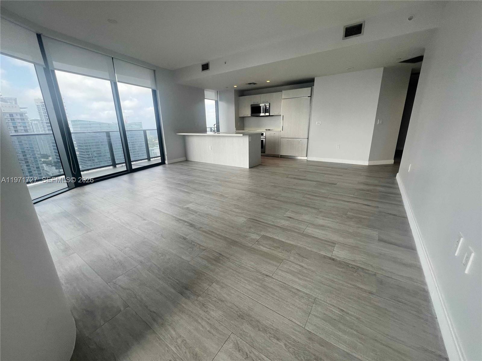 45 Southwest 9th Street, Unit 3703 Miami, FL 33130 - Photo 10 of 73 a view of a refrigerator in kitchen and a window