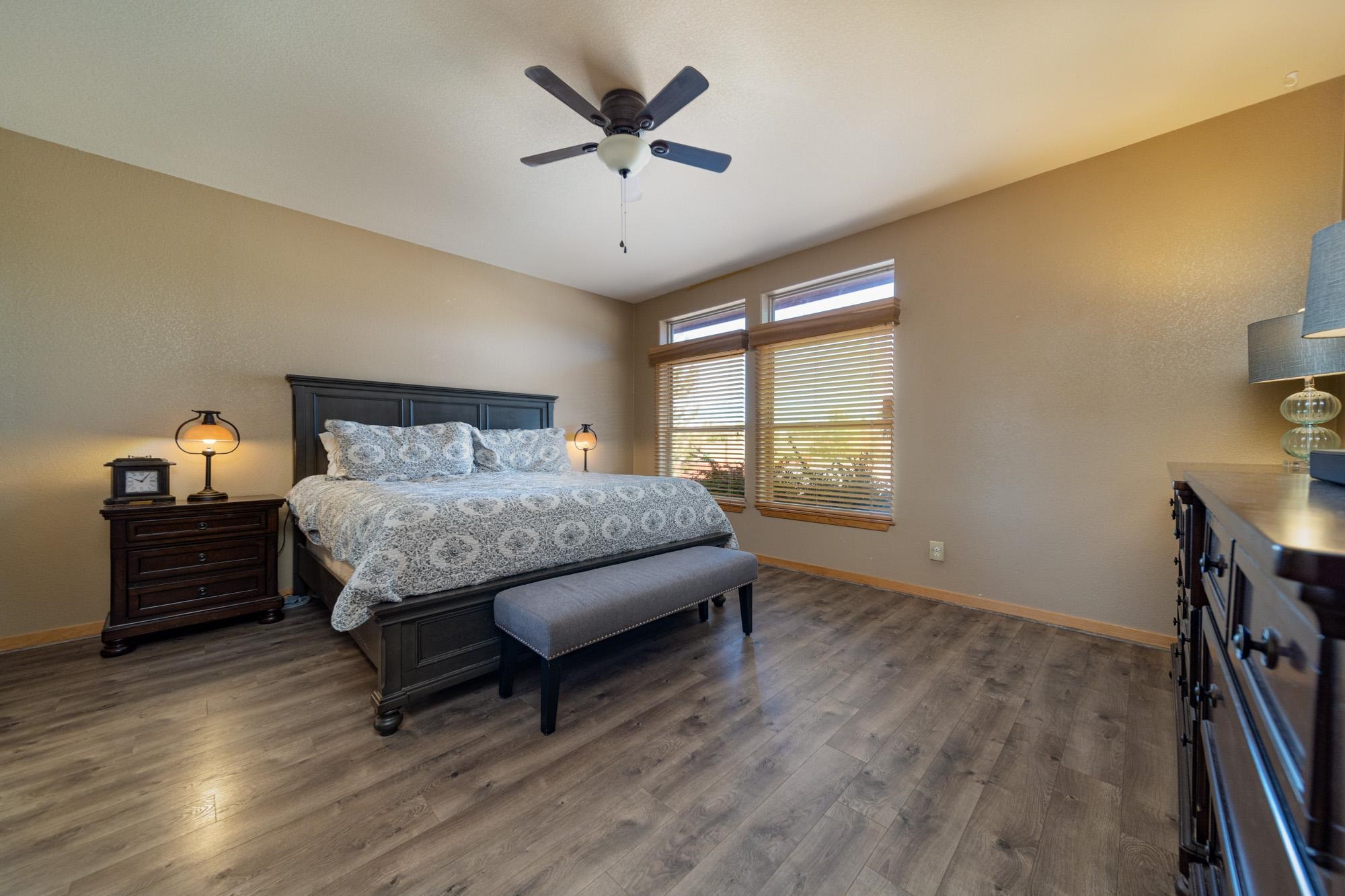 1745 North 3/10 Road Fruita, CO 81521 - Photo 13 of 41 a bedroom with a bed and a window