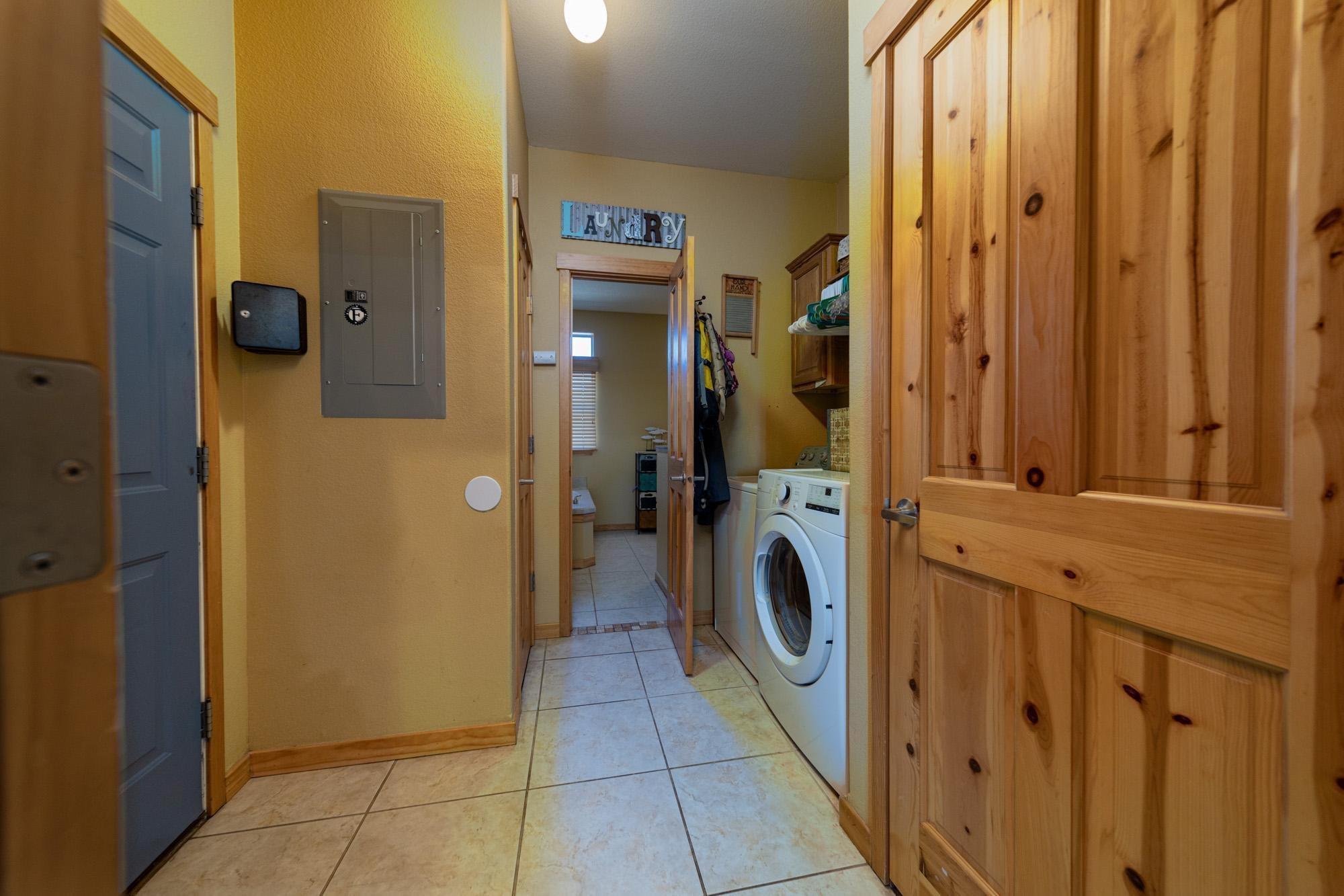 1745 North 3/10 Road Fruita, CO 81521 - Photo 18 of 41 a utility room with dryer and washer