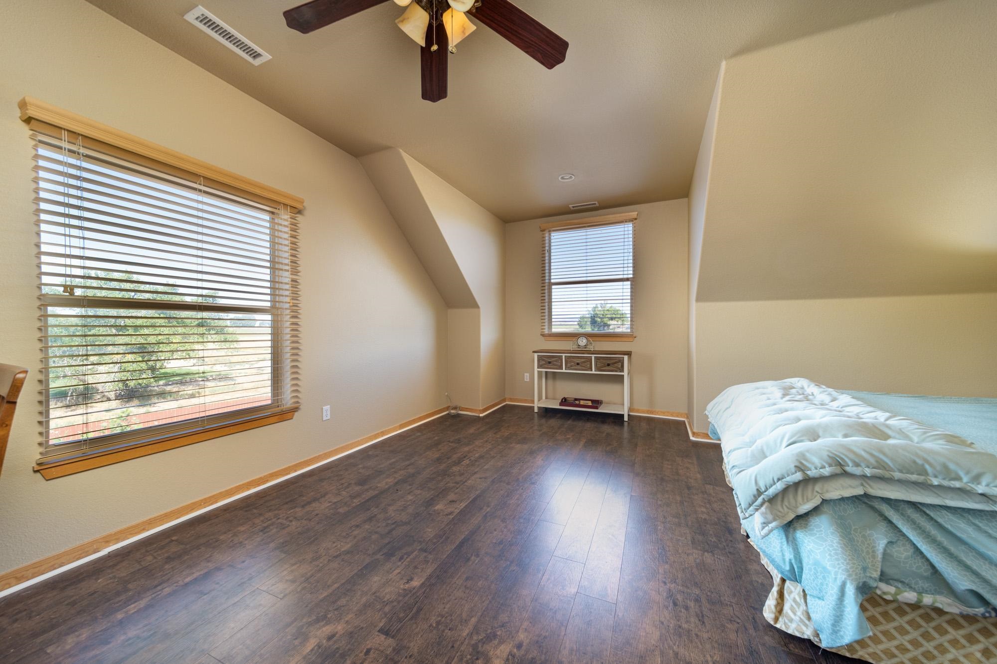 1745 North 3/10 Road Fruita, CO 81521 - Photo 22 of 41 a view of room with hardwood floor and window
