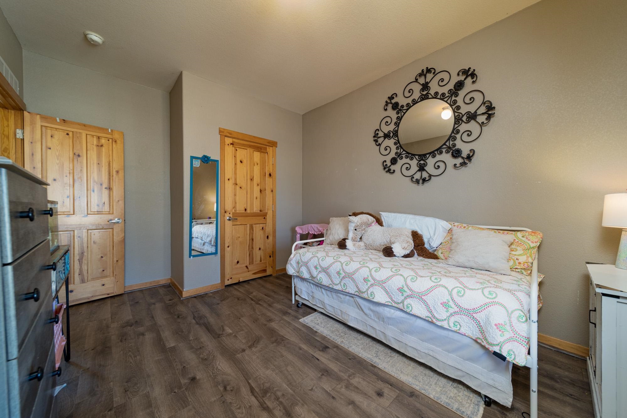 1745 North 3/10 Road Fruita, CO 81521 - Photo 24 of 41 a bedroom with double bed and a window