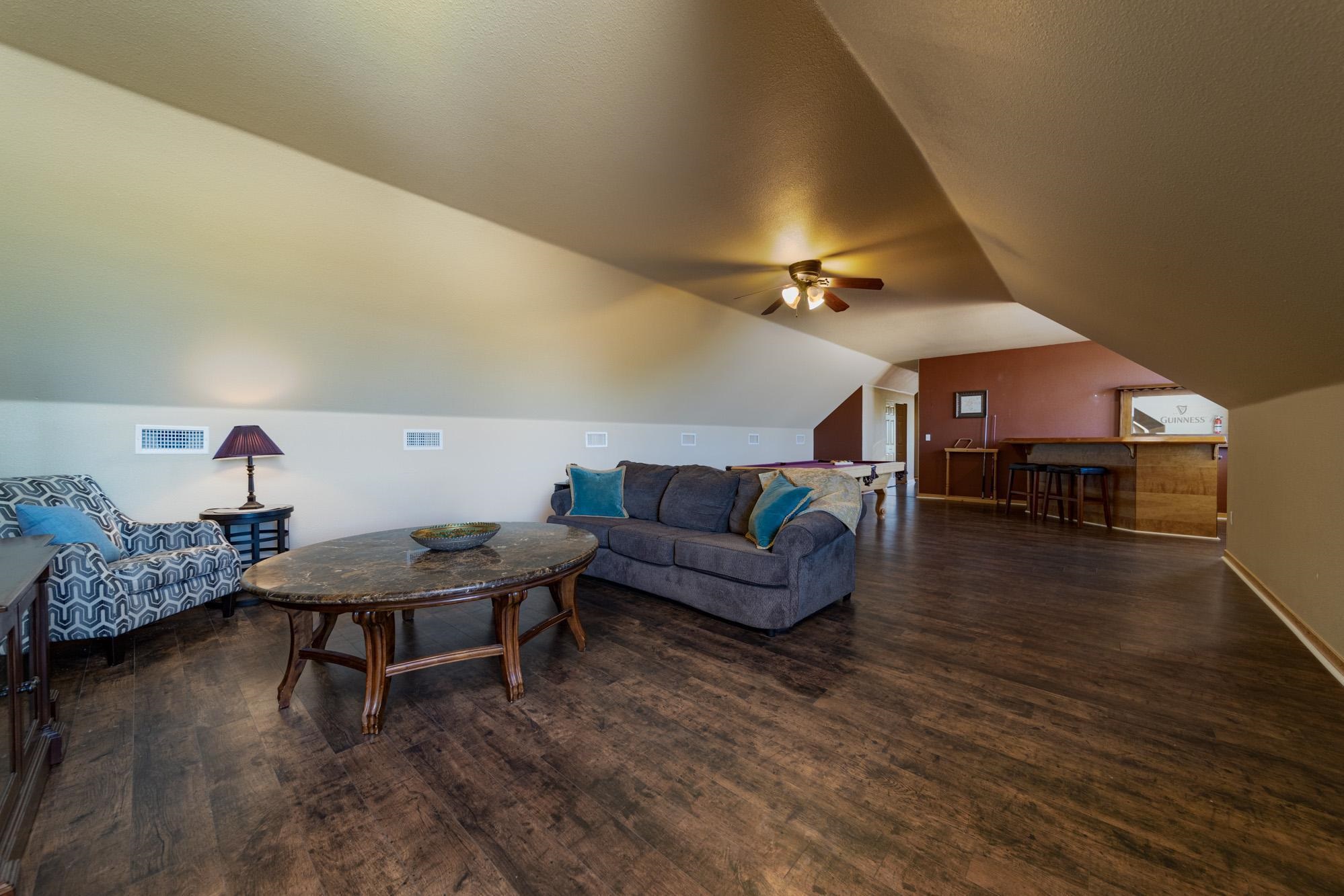 1745 North 3/10 Road Fruita, CO 81521 - Photo 26 of 41 a living room with furniture and a table