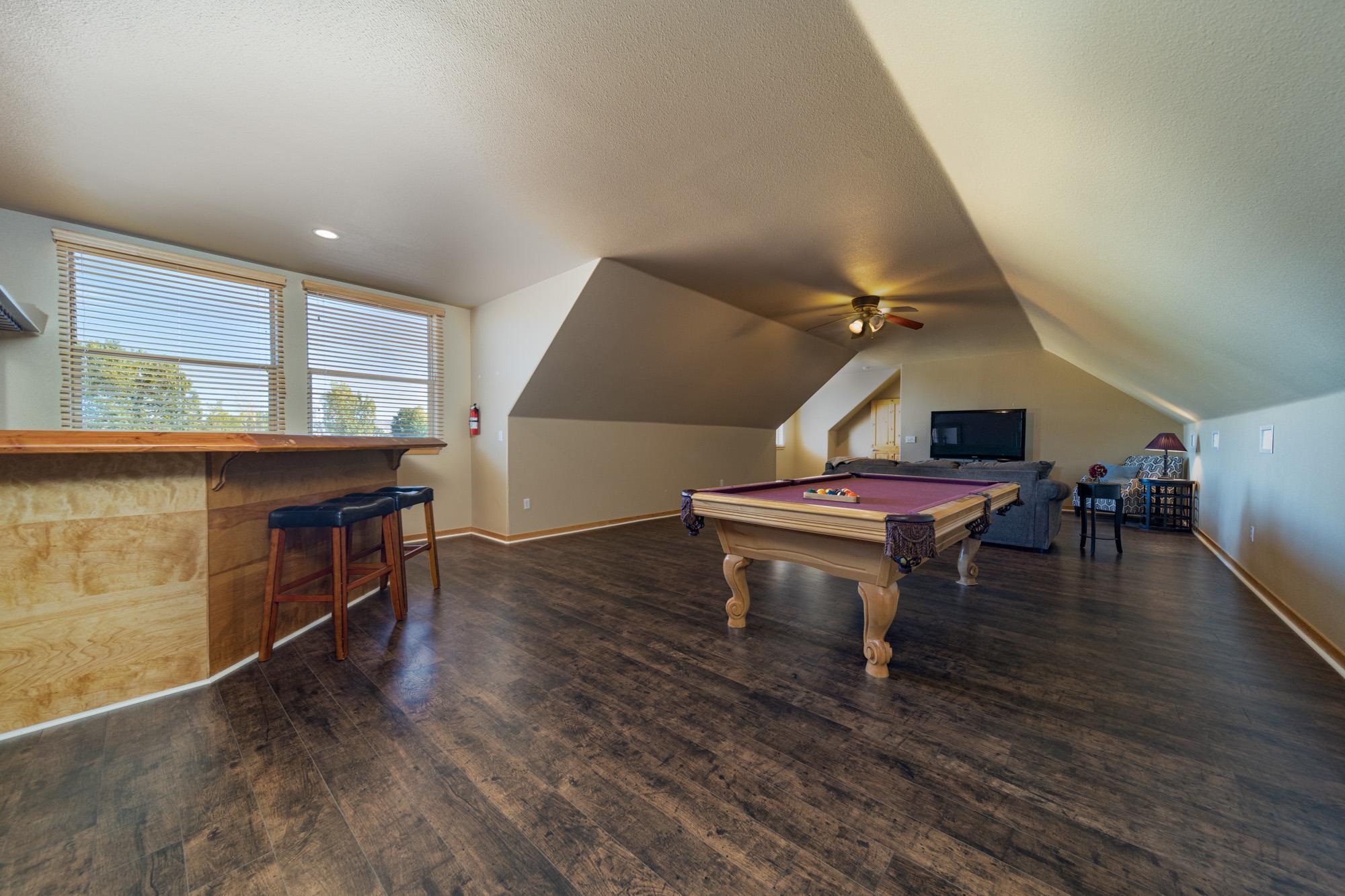 1745 North 3/10 Road Fruita, CO 81521 - Photo 28 of 41 a living room with furniture and a wooden floor