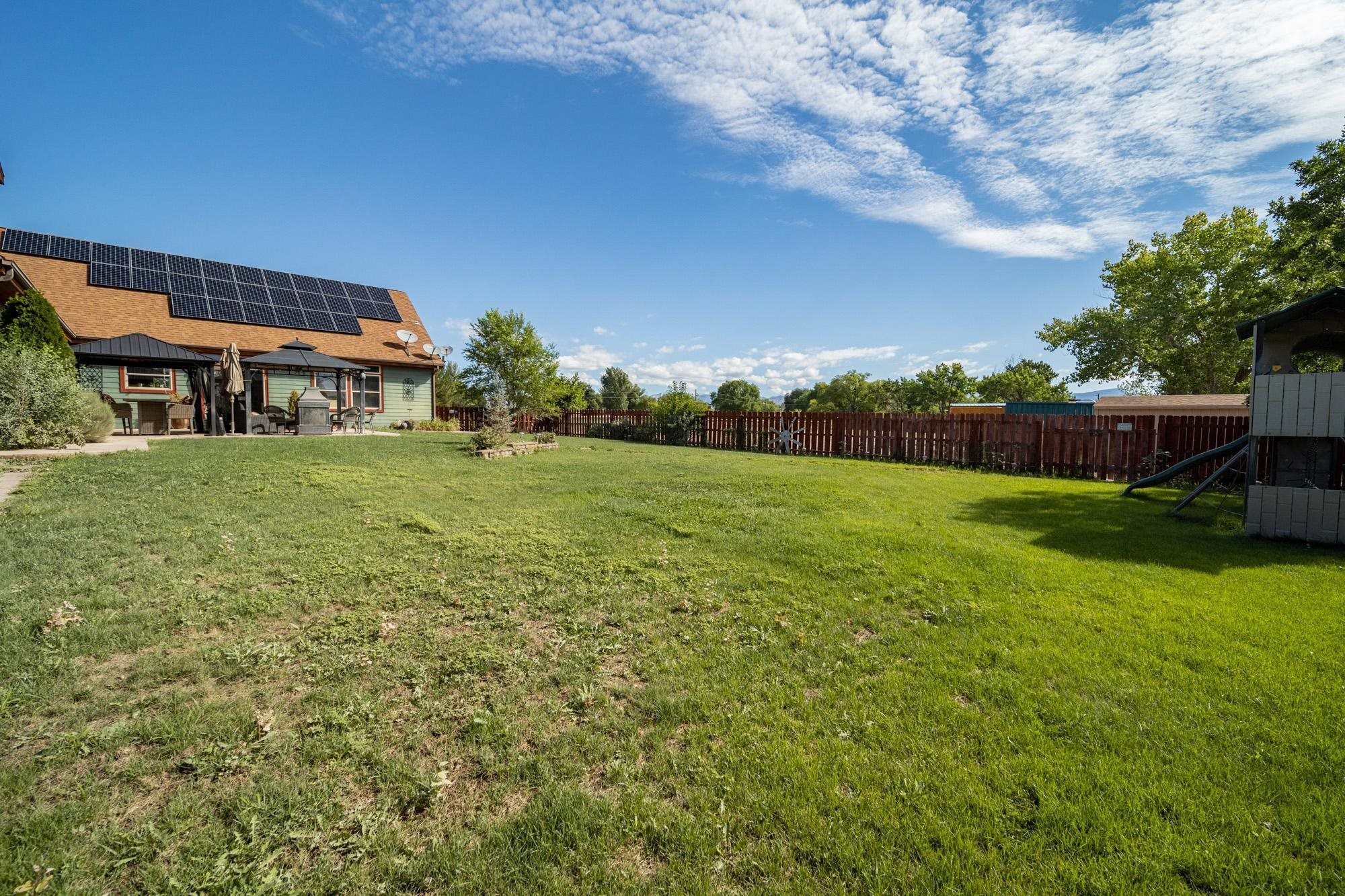 1745 North 3/10 Road Fruita, CO 81521 - Photo 35 of 41 a view of a house with a big yard