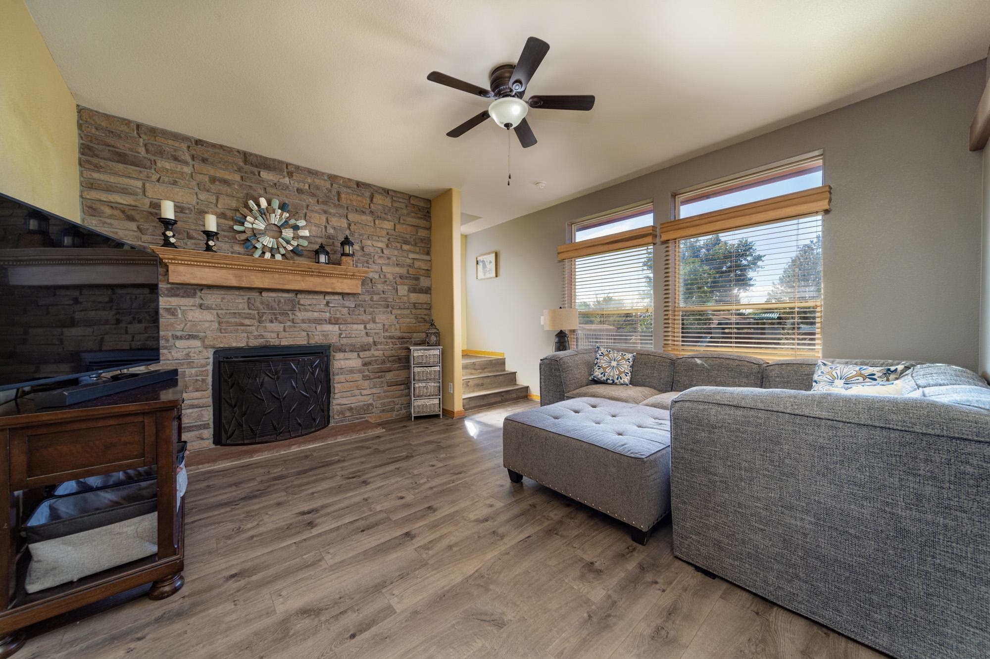 1745 North 3/10 Road Fruita, CO 81521 - Photo 4 of 41 a living room with furniture and a fireplace