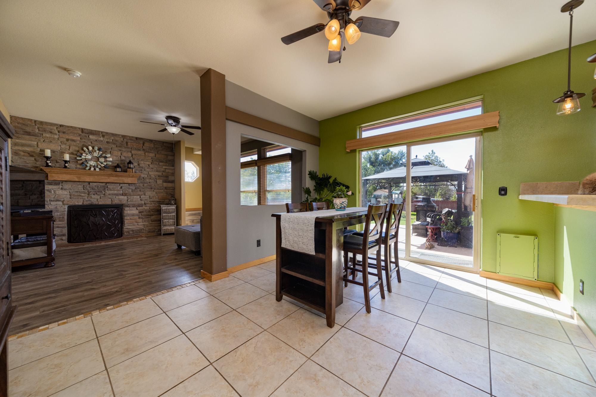 1745 North 3/10 Road Fruita, CO 81521 - Photo 7 of 41 a view of a livingroom with furniture and a fireplace