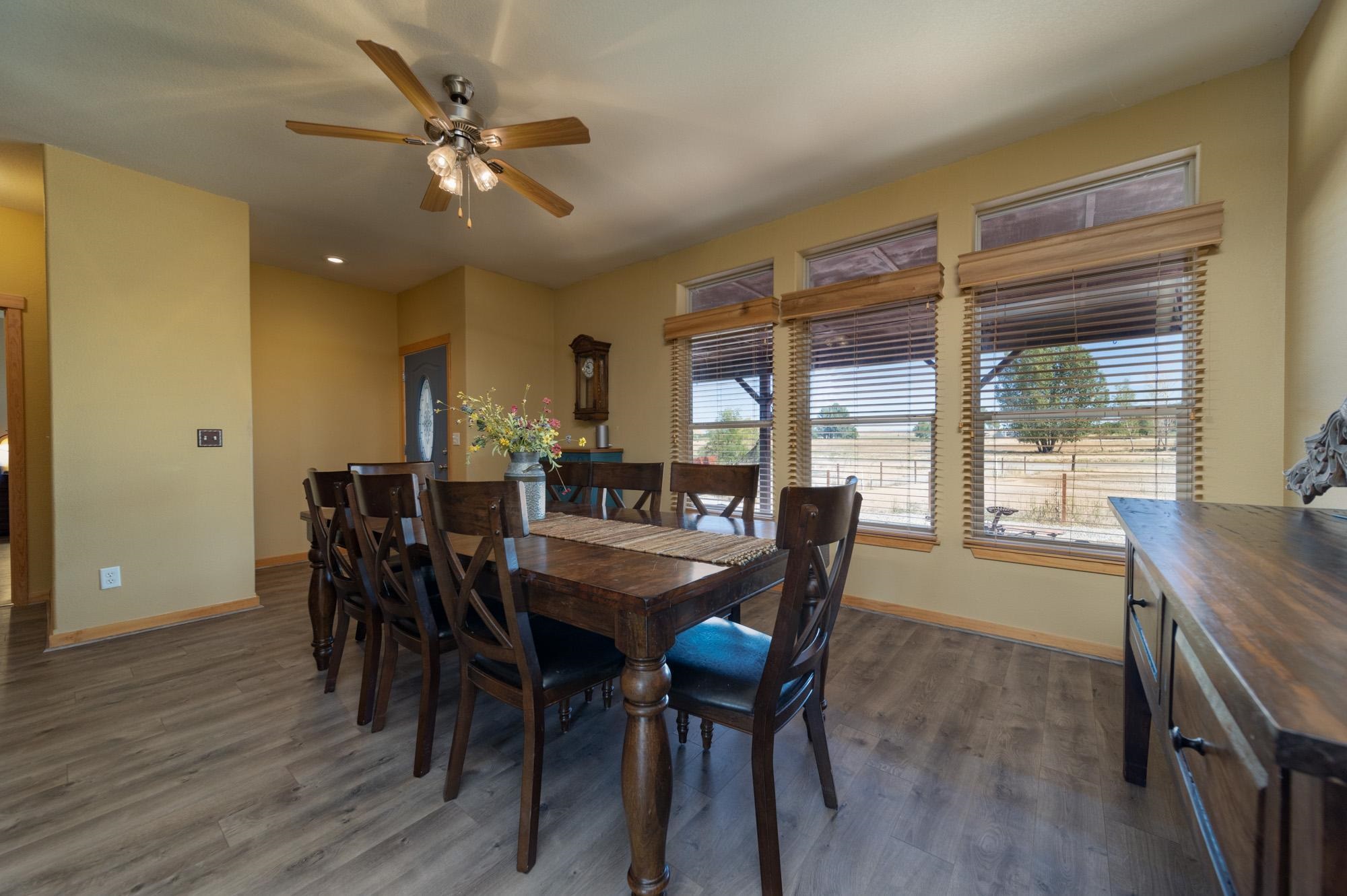 1745 North 3/10 Road Fruita, CO 81521 - Photo 10 of 41 a dining room with furniture and window