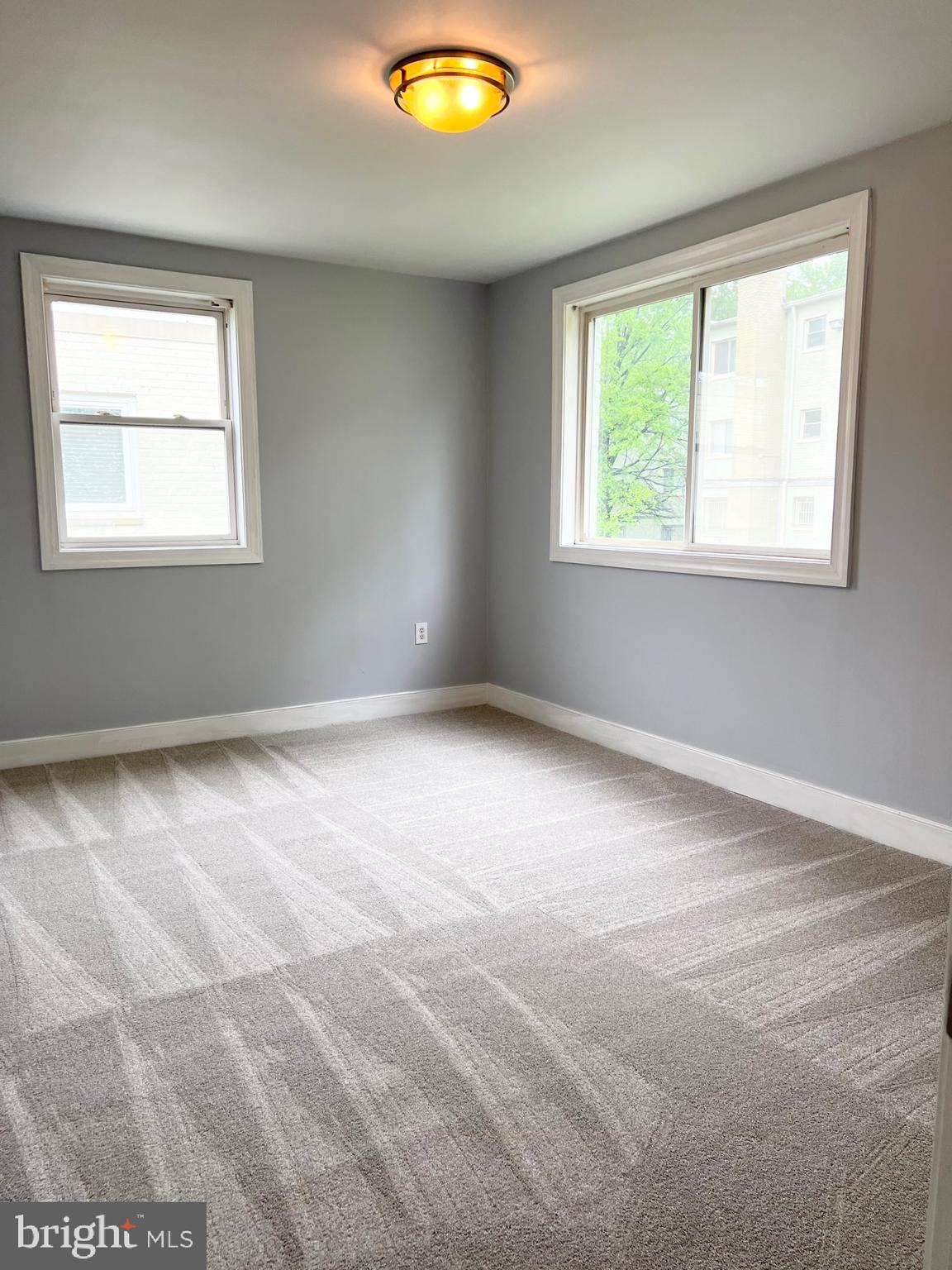 2841 Gainesville Street Southeast, Unit 203 Washington, DC 20020 - Photo 5 of 12 an empty room with a window