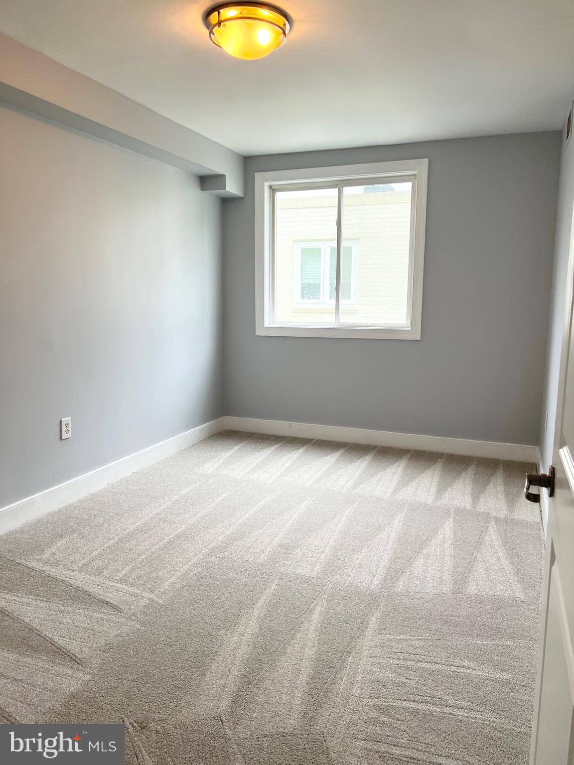 2841 Gainesville Street Southeast, Unit 203 Washington, DC 20020 - Photo 6 of 12 a view of a room with a window