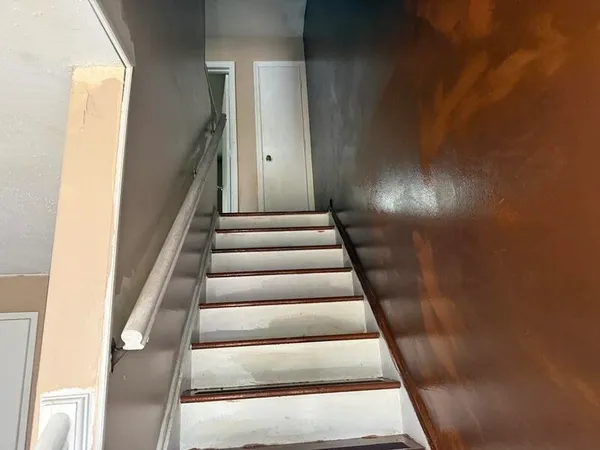 an empty room with a mirror