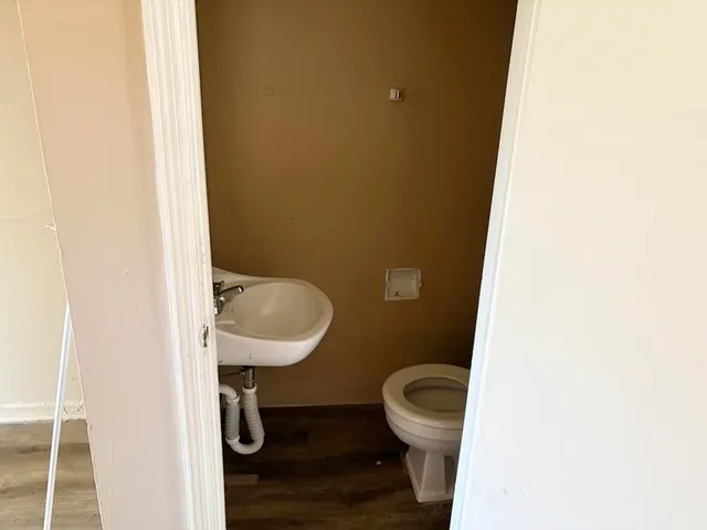 a bathroom with a toilet and a sink