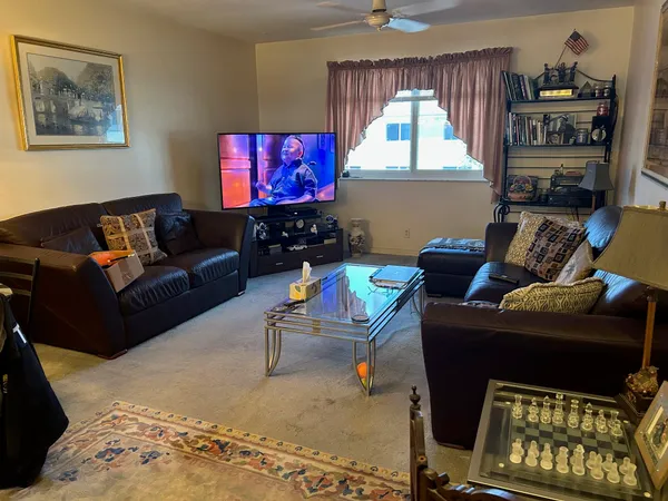 a living room with furniture and a window