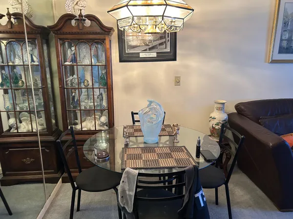 a view of a dining room with furniture and window