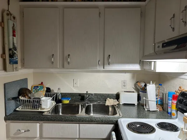 a kitchen with a sink and cabinets
