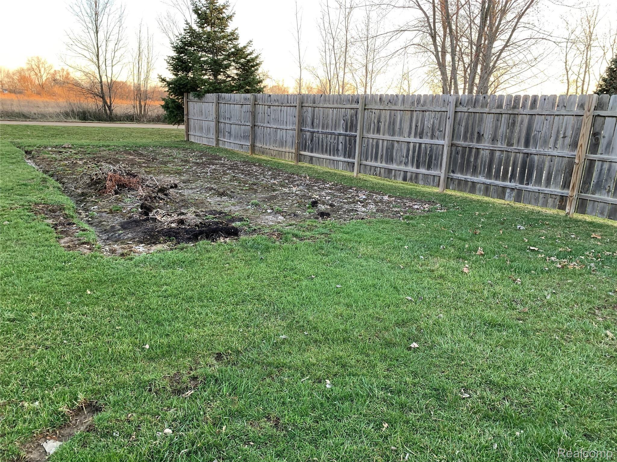 10497 Stelzer Road Howell, MI 48855 - Photo 28 of 31 10497 - 10499 Stelzer Rd. Garden area just waiting for new plants this spring!