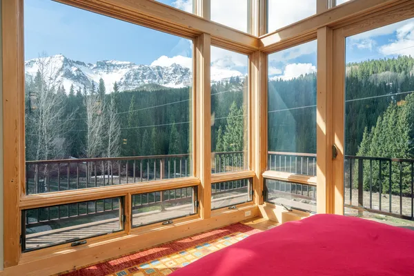 a view of a balcony with furniture