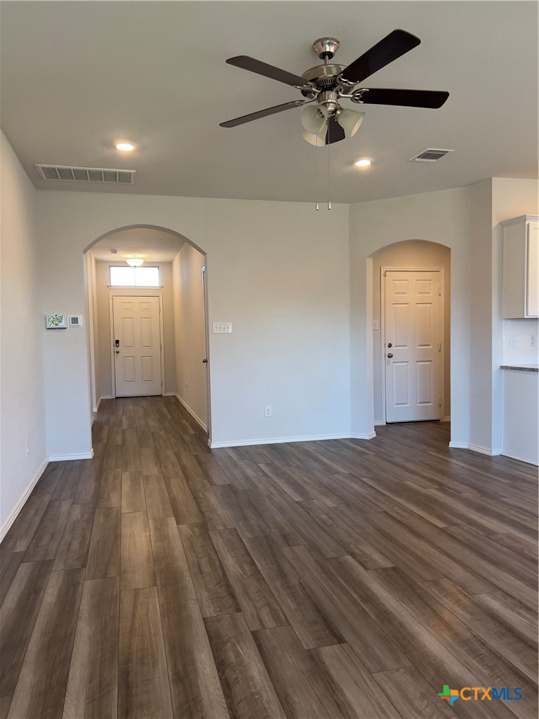 302 Saddleback Trail Killeen, TX 76542 - Photo 13 of 33 wooden floor in an empty room with a window