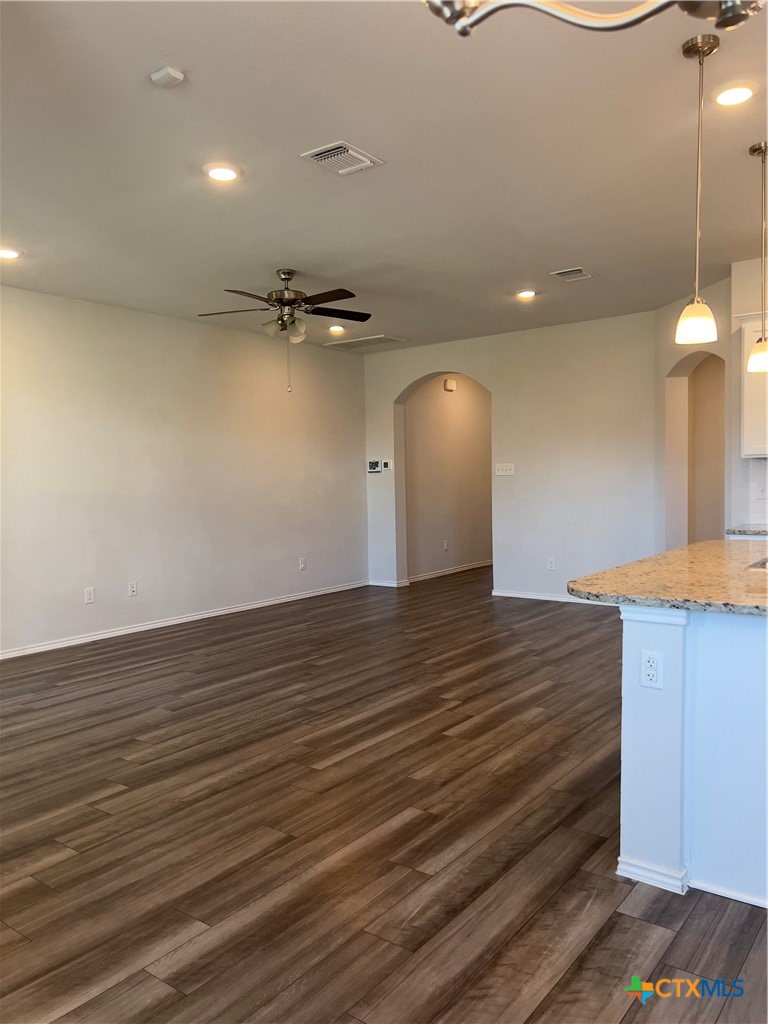 302 Saddleback Trail Killeen, TX 76542 - Photo 14 of 33 a view of a room with a ceiling fan and wooden floor