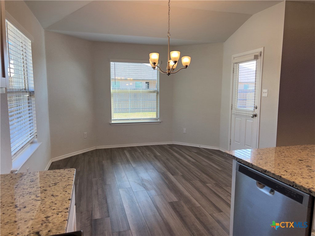 302 Saddleback Trail Killeen, TX 76542 - Photo 9 of 33 wooden floor in an empty room with a window