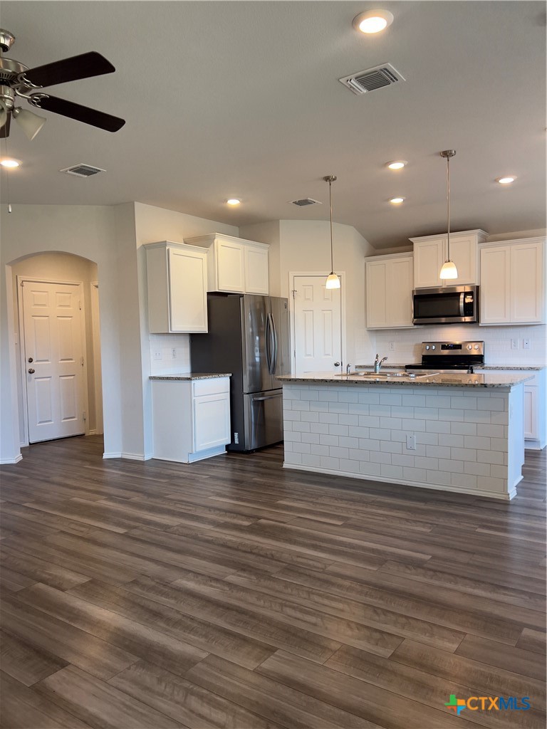302 Saddleback Trail Killeen, TX 76542 - Photo 10 of 33 a view of kitchen with kitchen island microwave and cabinets