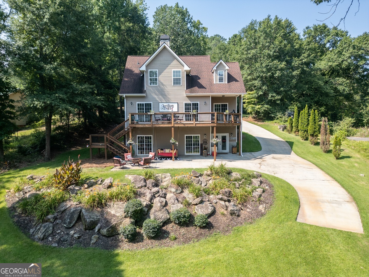 734 Raven Road Monticello, GA 31064 - Photo 12 of 81 a front view of a house with a yard table and chairs
