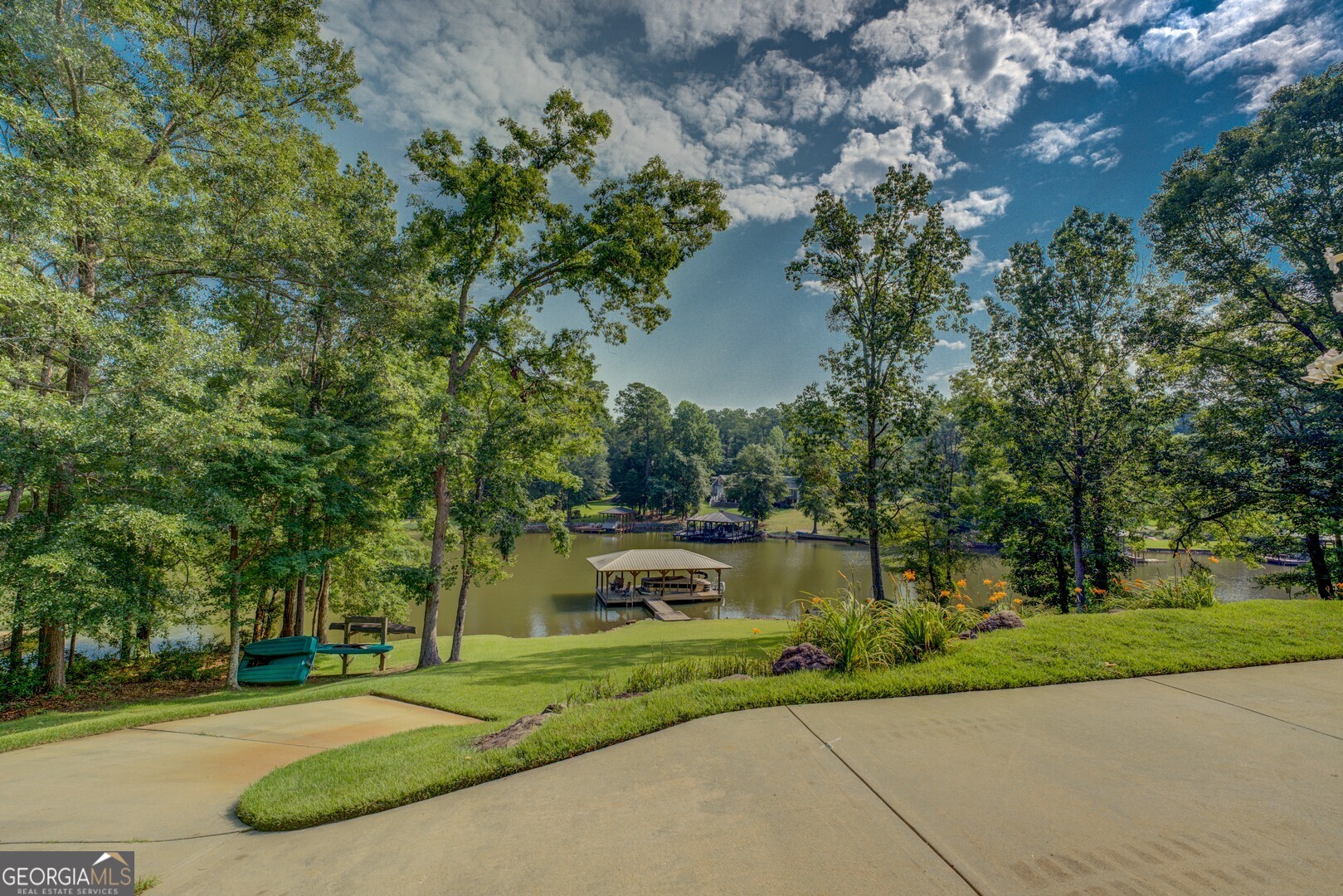 734 Raven Road Monticello, GA 31064 - Photo 19 of 81 a front view of a house with a yard and large trees